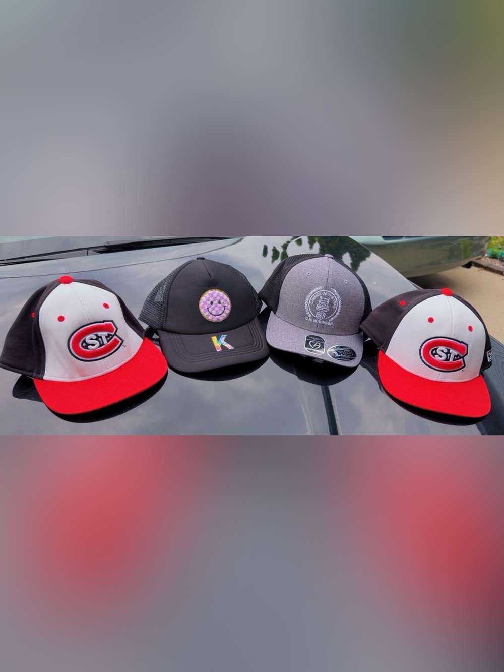 Lot of 4 Trucker Baseball Caps SCSU, C.H. Robinson & Smiley Hat Bundle
'